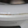 Kenmore - elite washer rusting at bleach tray, dryer cause black stains on clothing