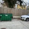 Waste Management [WM] - blocking car with dumpsters.