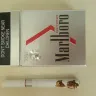Marlboro - damaged marlboro red beyond cigarette in package