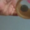 Tim Hortons - icecap with a dirty coin at the bottom - Photo 1