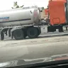 Kroger - employee smoking at gas tanks and gas truck - Photo 2