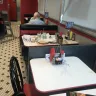 Steak 'n Shake - food on tables and very dirty restaurant