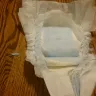 Huggies - dried up plastic piece of diaper that stabbed my son in his genitals - Photo 1