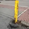 Burlington Northern Santa Fe [BNSF] - this parking lot has piece of railroad used as a safety pole - Photo 3