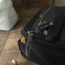 Caribbean Airlines - suitcase front pocket totally ripped off - Photo 1