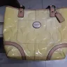 Coach - color has changed from pink to yellow without usage and no exposure to sun at all. - Photo 1
