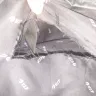 Air India - my bag got a big cut from inside pocket and food from the checked in bag got stolen. - Photo 2