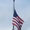 JPMorgan Chase - tattered and torn american flag and missing finial at franklin, new jersey branch.