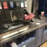 Sheetz - parking lot, gas pumps, and inside the store are filthy