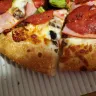 Boston Pizza International - medium deluxe pizza wasn't as stated