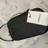 Farfetch - Prada flat mini bag that came without shoulder strap (as advertised)
