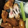 Outback Steakhouse - Wings, not cooked thoroughly.