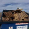 Walmart - walmart driver unloading his trash in our dumpsters