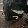 Oman Air - ripped bag with missing items