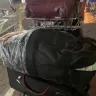 Oman Air - ripped bag with missing items