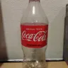 Coca-Cola - tasted weird and bottle had metal smell - Photo 1