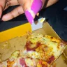 Debonairs Pizza - Pizza had a wire from a wire brush