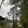 Alabama Power - A power pole leaning really bad and has the mast on my house tight as a zipcord and leaning also. It has been like this for over 7 years.