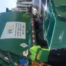 Waste Management [WM] - Waste Management trash pickup truck man  - Photo 2