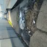 Long Island Rail Road [LIRR] - Uneven sidewalk, dirty sidewalk.