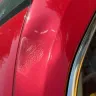 Firestone Complete Auto Care - Dent on top of car