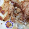 Roman's Pizza - We have examined the images sent, and can confirm that those are not fly eggs, nor what fly eggs look like.