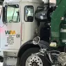 Waste Management [WM] - WM Truck blocking public parking garage exit
