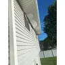 Power Home Remodeling - Soffit not nailed in and falling endangering homeowner and visitors - Photo 2