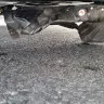 Mr. Lube Canada - Oil change where the skid plate wasn't properly re-attached. - Photo 2
