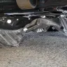 Mr. Lube Canada - Oil change where the skid plate wasn't properly re-attached. - Photo 1
