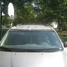 Toyota - dealer's garage enter door hit my car when I drove in - Photo 1