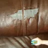 Ashley HomeStore - peeling couch/ broken tables/ popped stitching - Photo 1