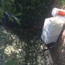 Spectrum.com - cable lines flung over cinder block fence - Photo 1
