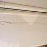 General Electric - ge refrigerator is corroding and leaking through a hole in main panel of refrigerator - Photo 1