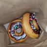 Dunkin' Donuts - chocolate frosted donuts with sprinkles