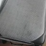WestJet Airlines - disgusting service, covered my luggage in black mess, 15 minutes to change flights - Photo 1