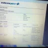 WestJet Airlines - a very large dog (a labradoodle) boarded on flight with a mother and small child in the cabin - Photo 1