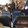 WestJet Airlines - a very large dog (a labradoodle) boarded on flight with a mother and small child in the cabin