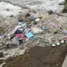 Real Canadian Superstore - entrance to the store littered with garbage - Photo 1